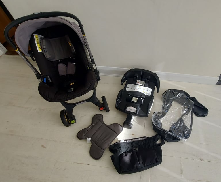 image for Doona pushchair car seat buggy travel school trips a must have, rain cover,isofix,nappy bag,