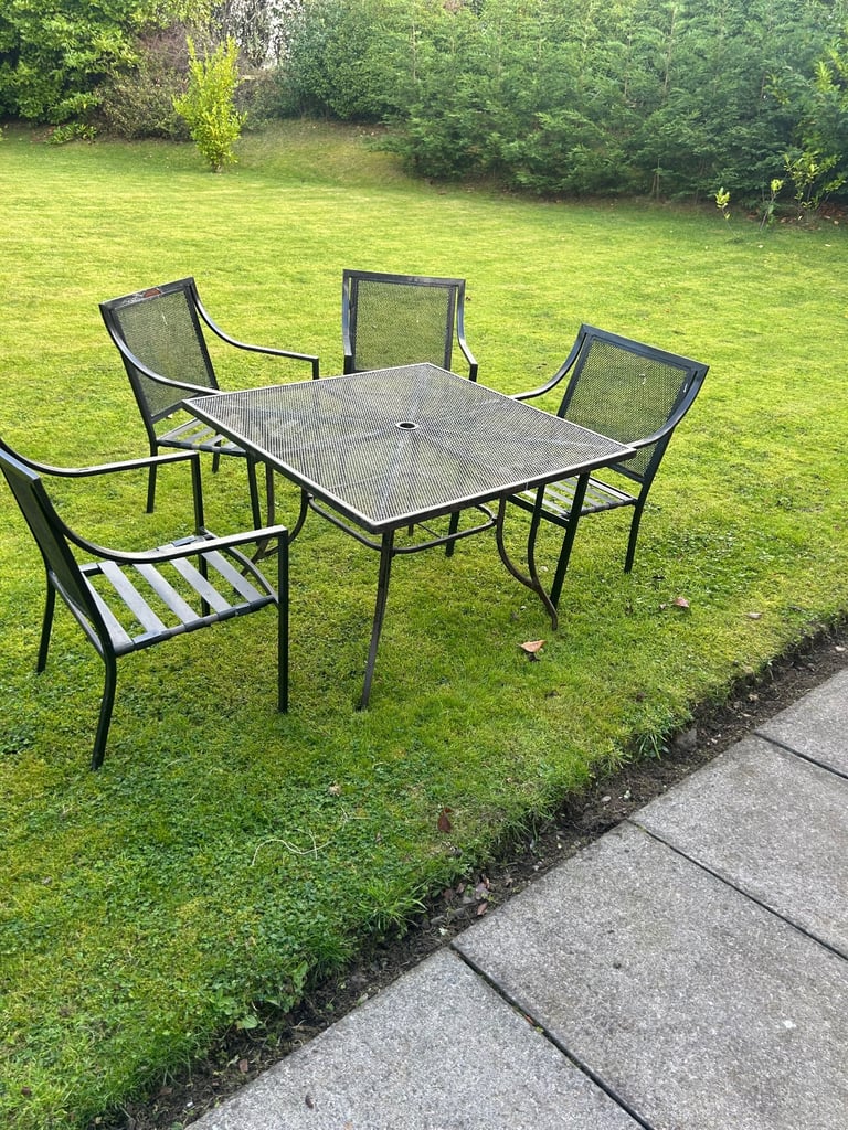 image for Garden all weather table and chairs with four cream cushions 