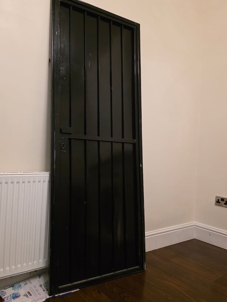 Very heavy metal security door with key