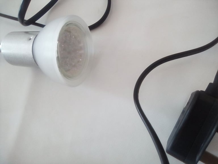 Flexible light, clips onto office desk or work bench.