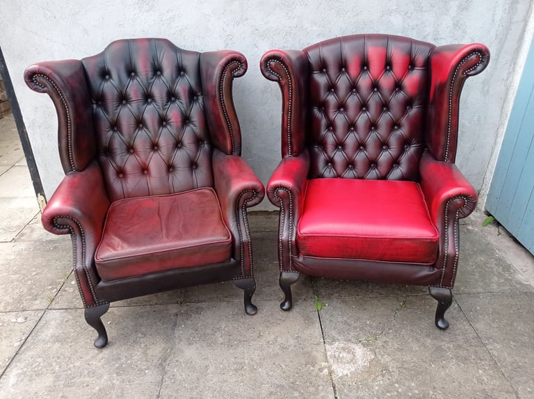 image for A Pair Of Red Leather Chesterfield Queen Ann/ Wing Armchairs