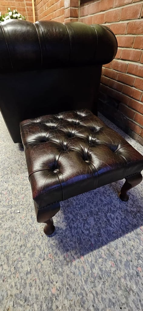 Beautiful vintage 2 seater chesterfield sofa with matching footstool.