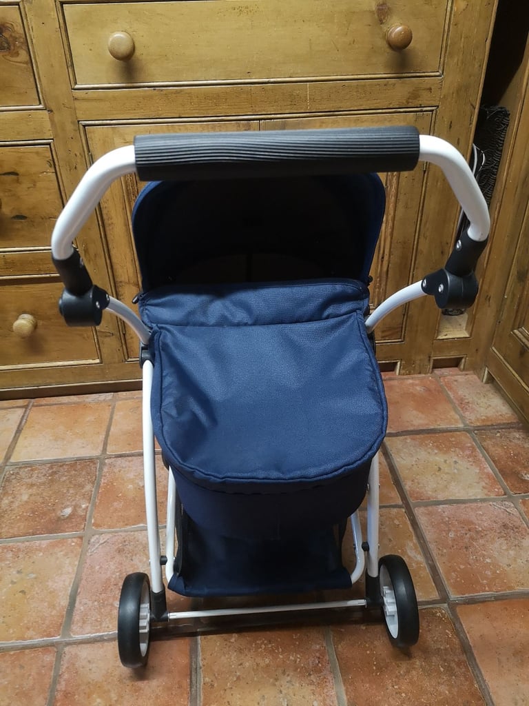 Brio Spin luxury toy pram for dolls & soft toys. Navy blue. Adjustable handle. Great used condition.