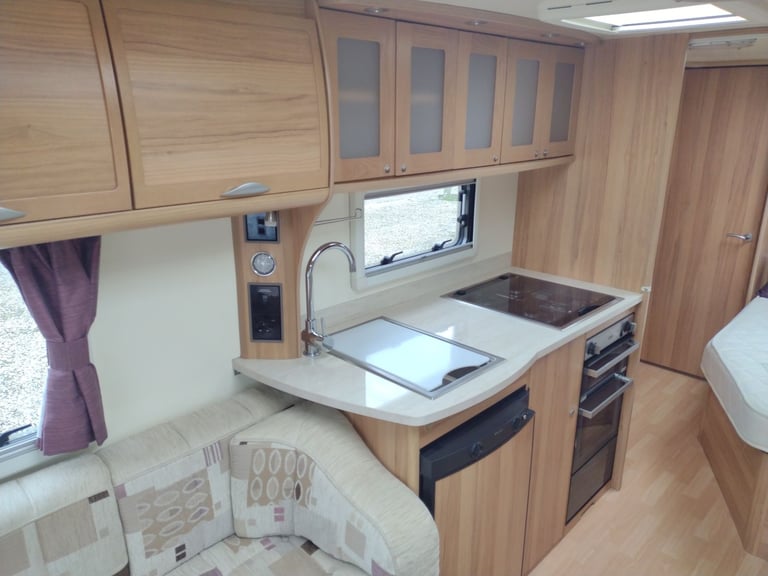 Bailey unicorn Valencia 2012 caravan fixed bed motor mover awning 