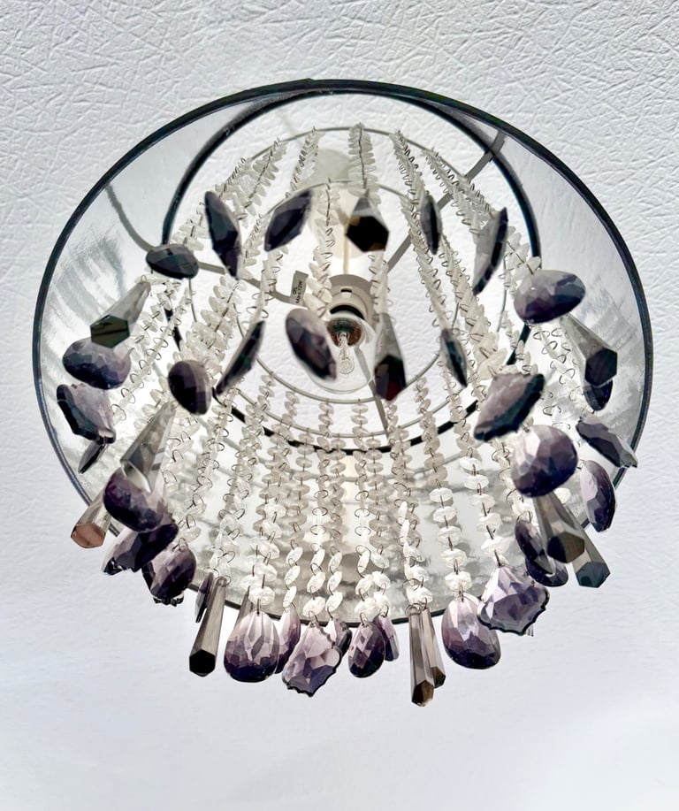 Grey pleated satin shade with drop cristals Measuring 35x 35 cm. Drop crystal plastic 