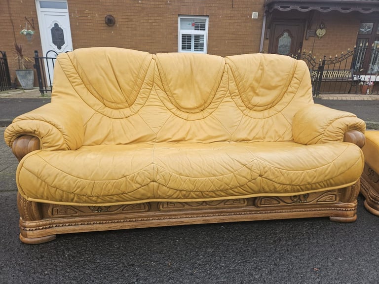 Leather sofa in soild oak inset with matching footstool 