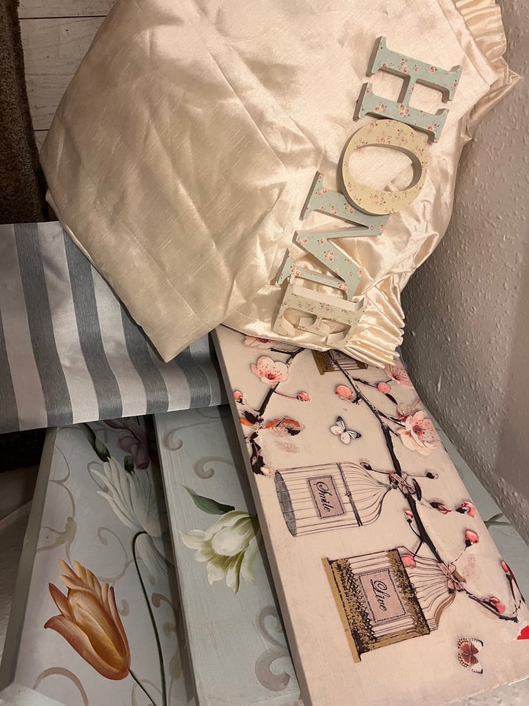 A selection of canvasses , cream satin extra long curtains 
