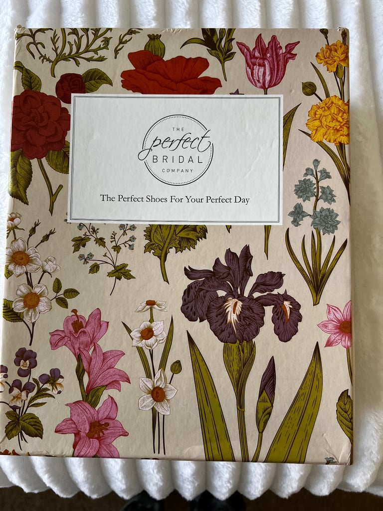 White satin heeled shoes