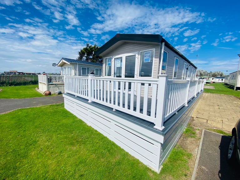 Stunning brand new static caravan, with decking, on the beach front, use 11.5 months per year.