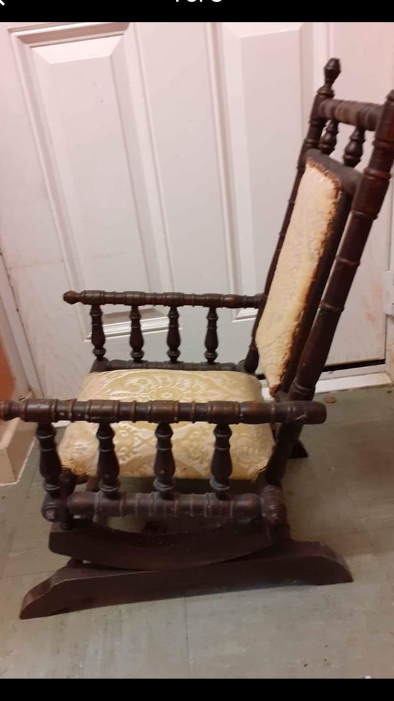 Antique child’s rocking chair doll