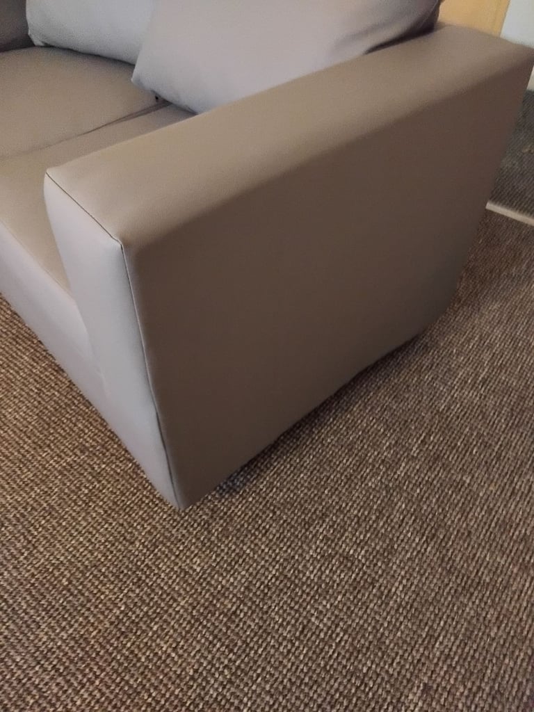 Brand new small 2 seater grey leather couch