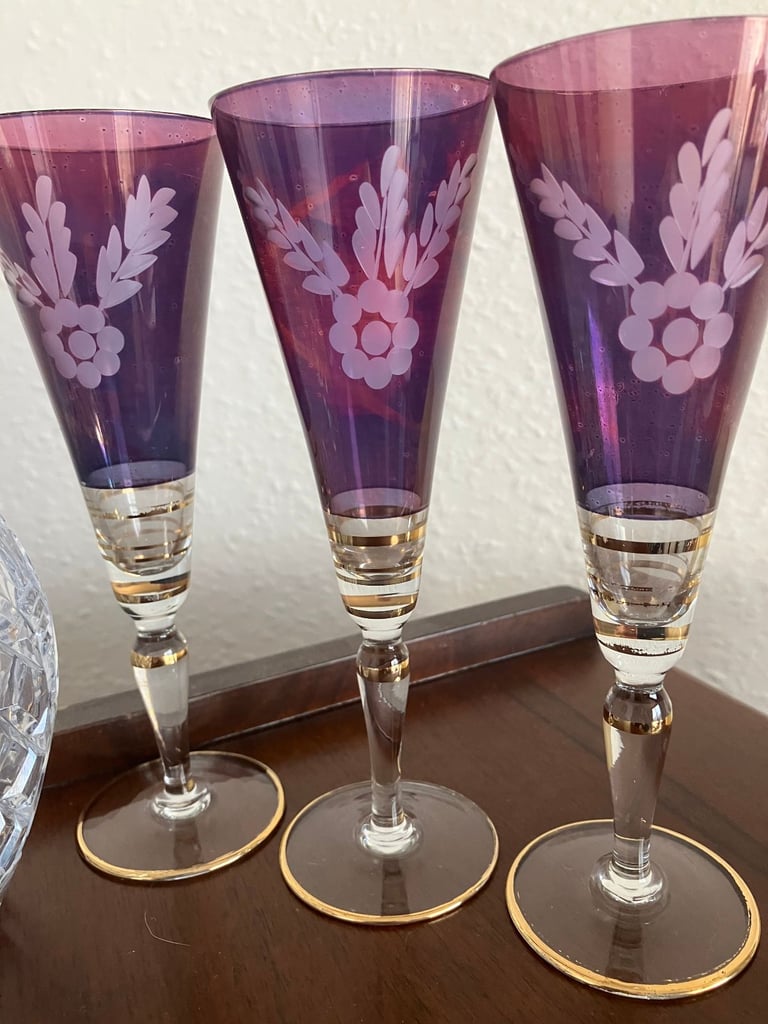 Heavy glass decanter and six vintage wine glasses.