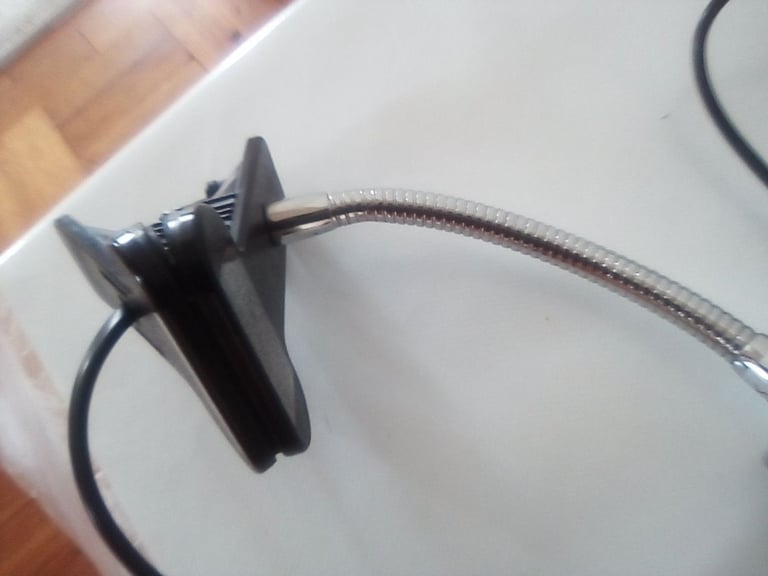 Flexible light, clips onto office desk or work bench.