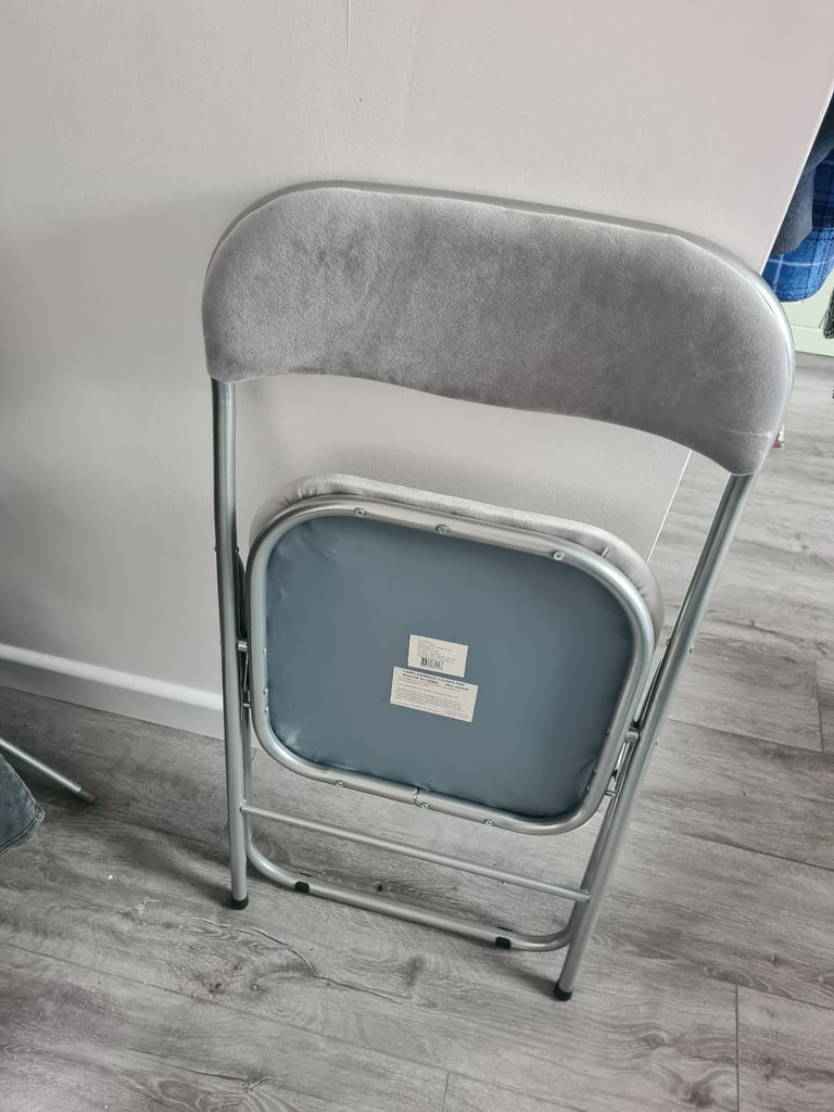 Grey foldable chair.