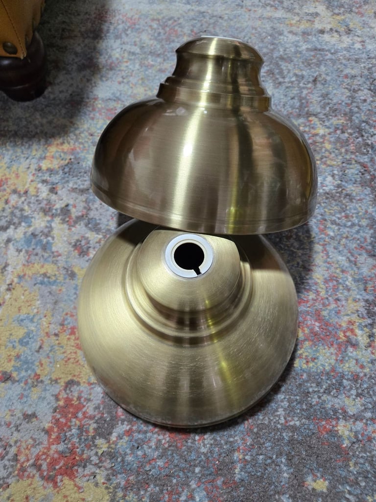 2 x gold coloured metal lampshades.