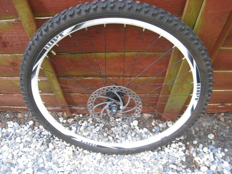 carrera 26 inch disc brake wheel - front - 180mm disc , good tyre , white rim 
