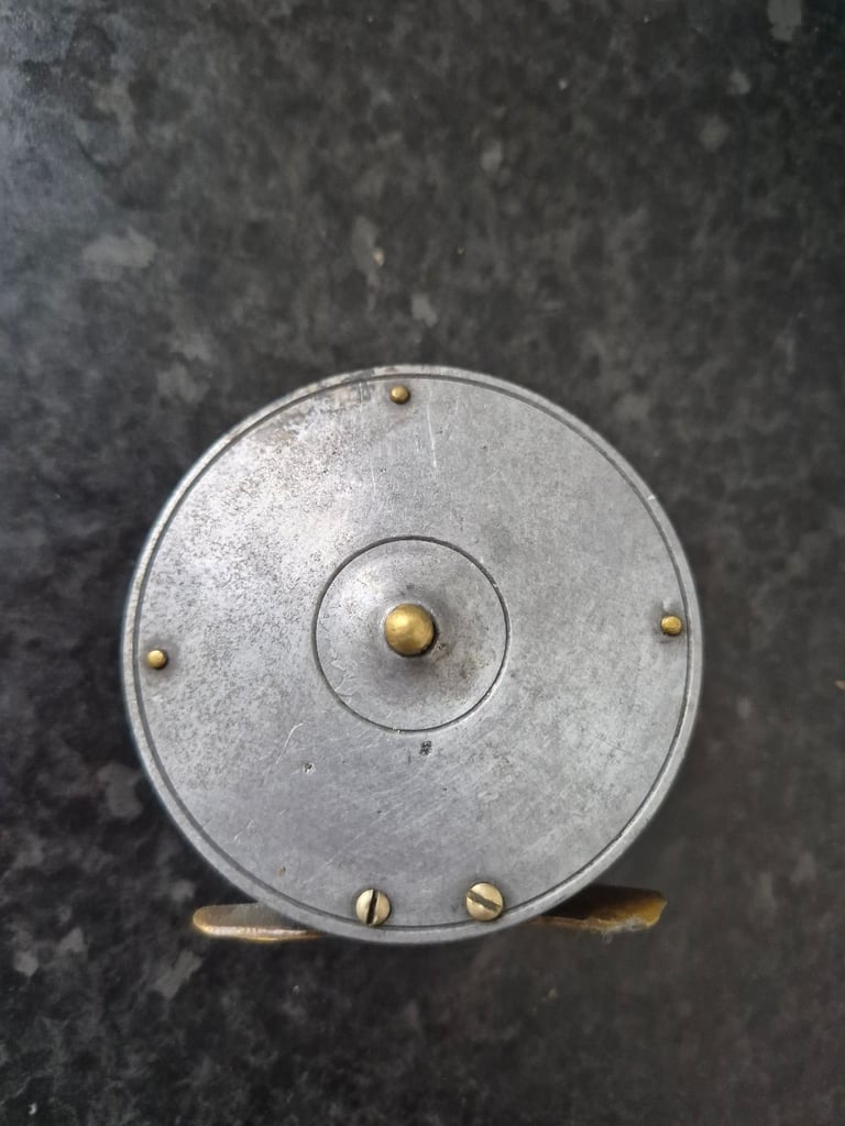 Brass era fishing reel 