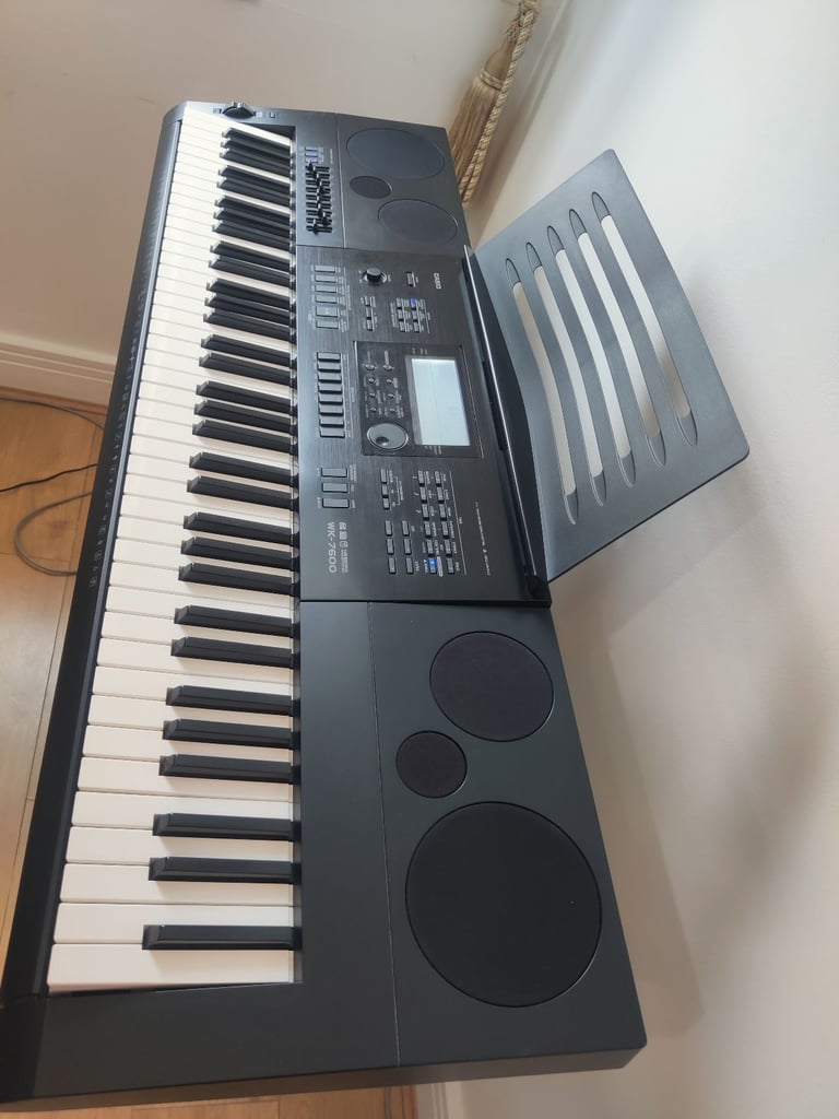 Casio WK-7600 76 Key Piano Style Portable Keyboard with Metal Stand and Pedal