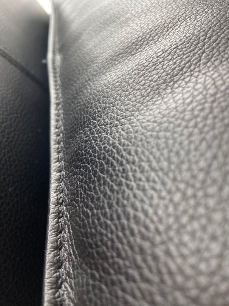 2 firm decorative leather pillows.