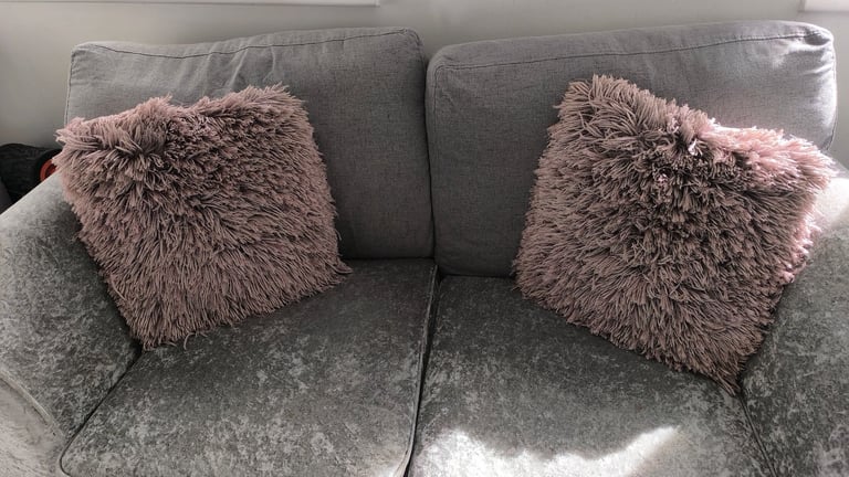Pair of pink fluffy cushions 