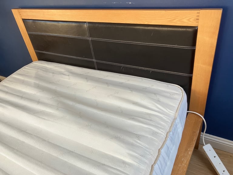 Oak King Size Wooden bed frame with four underbed wheeled drawers 