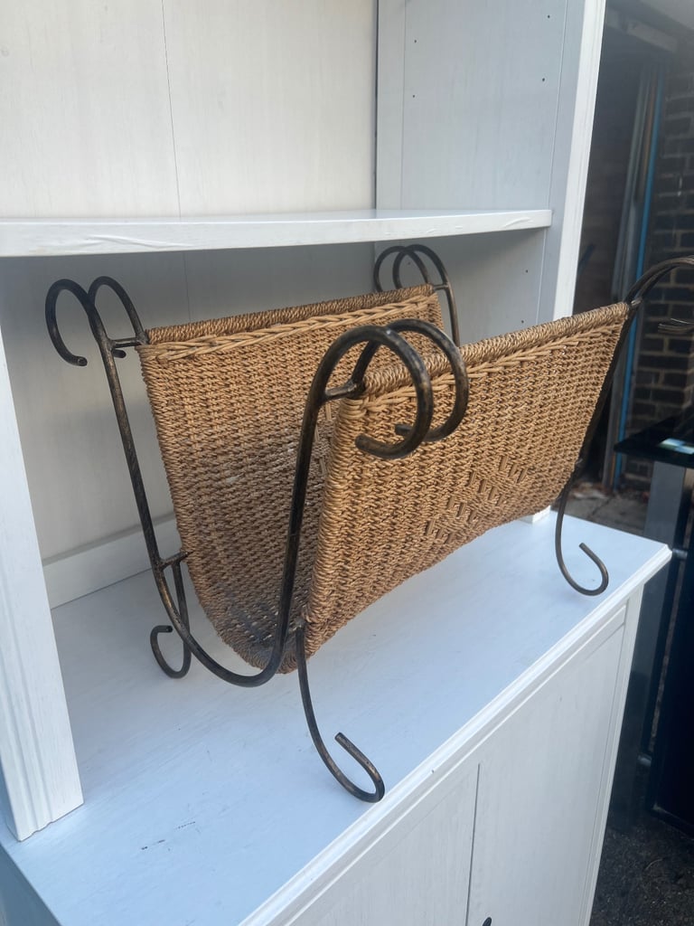 Ornate iron framed wicker magazine rack