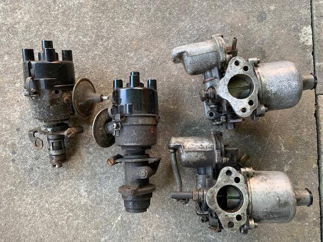 Triumph carburetors and distributer heads.