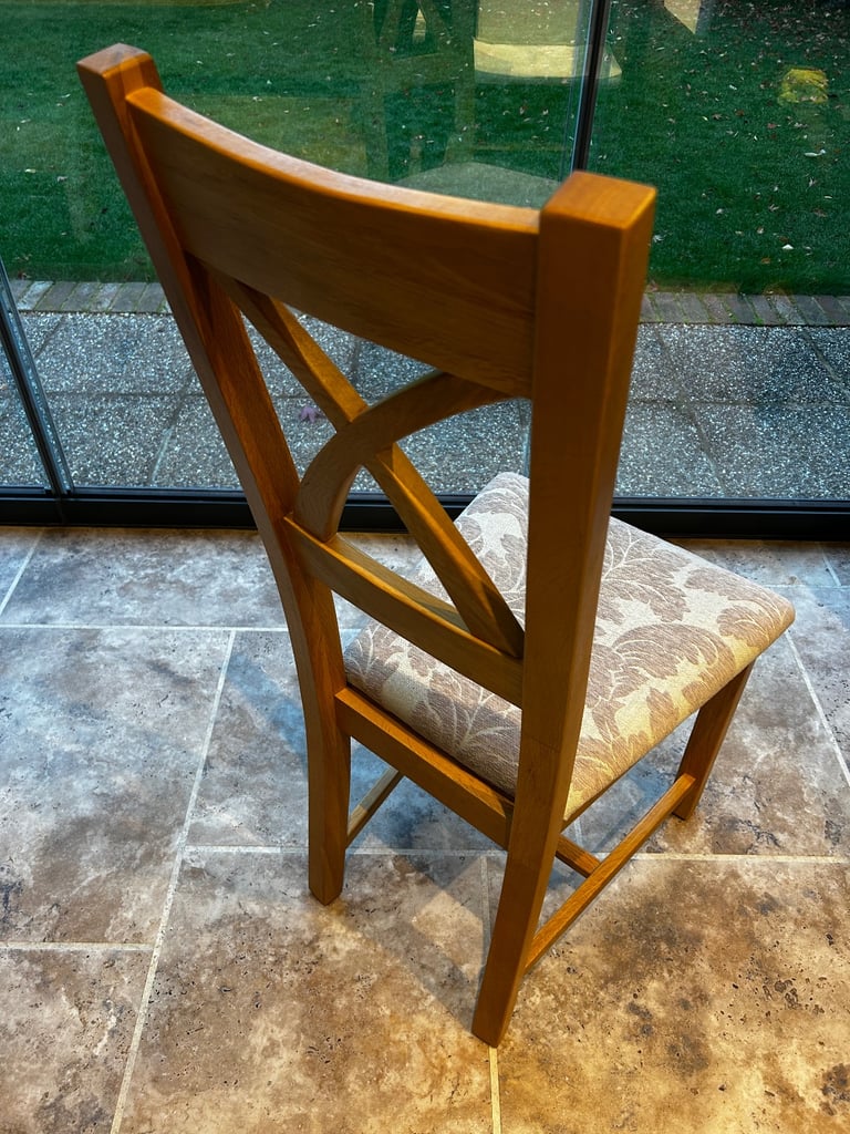 Solid oak dining table and six chairs