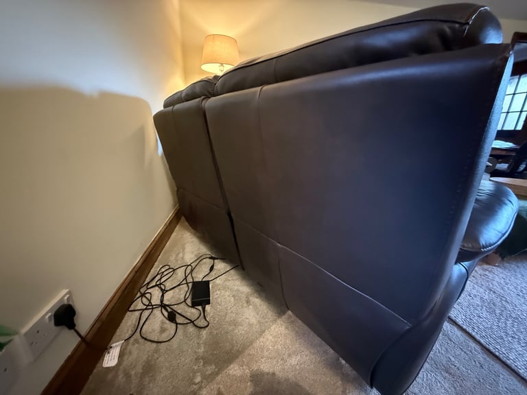 Leather two seater reclining sofa