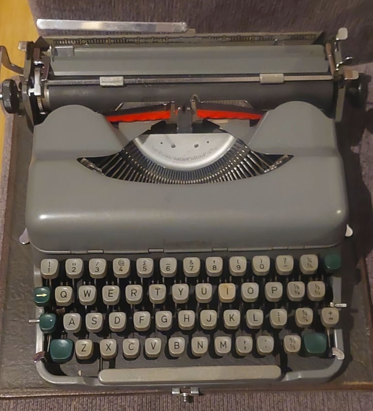 Old manual typewriter with case