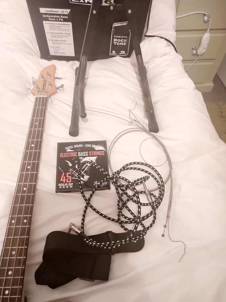Yamaha RBX170 4 String Bass. Line 6 LD 15watt Bass Amp. Both in Mint Condition . Lots of Extras