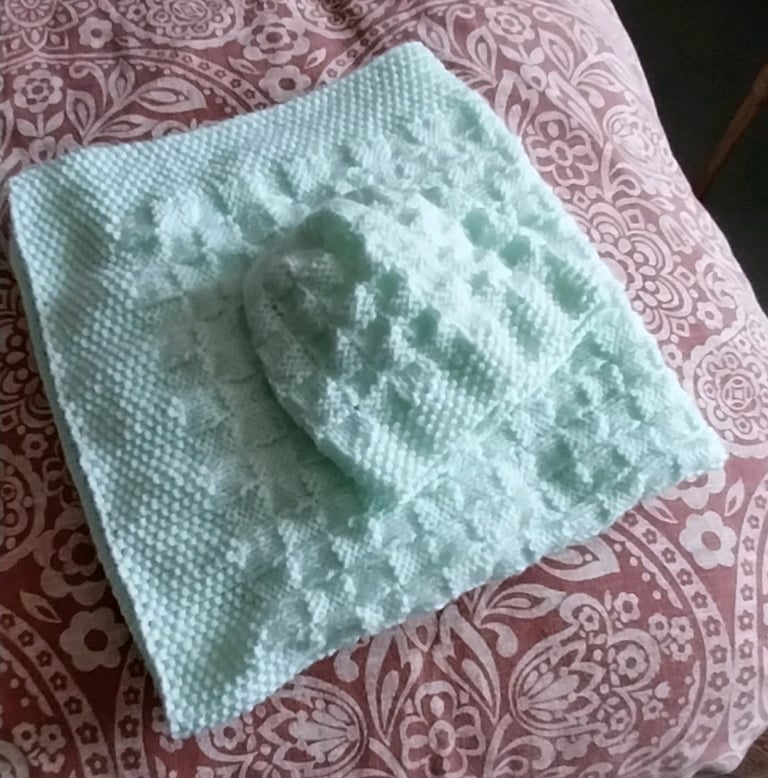Hand knitted baby blanket and hat