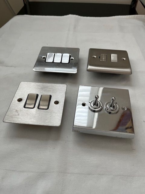 Assorted electrical switches in chrome/steel finish