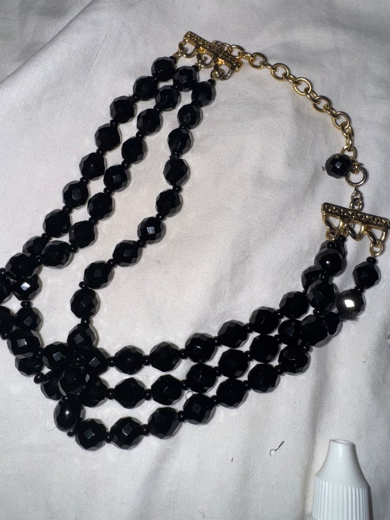 Multi layer black onyx gold tone necklace 