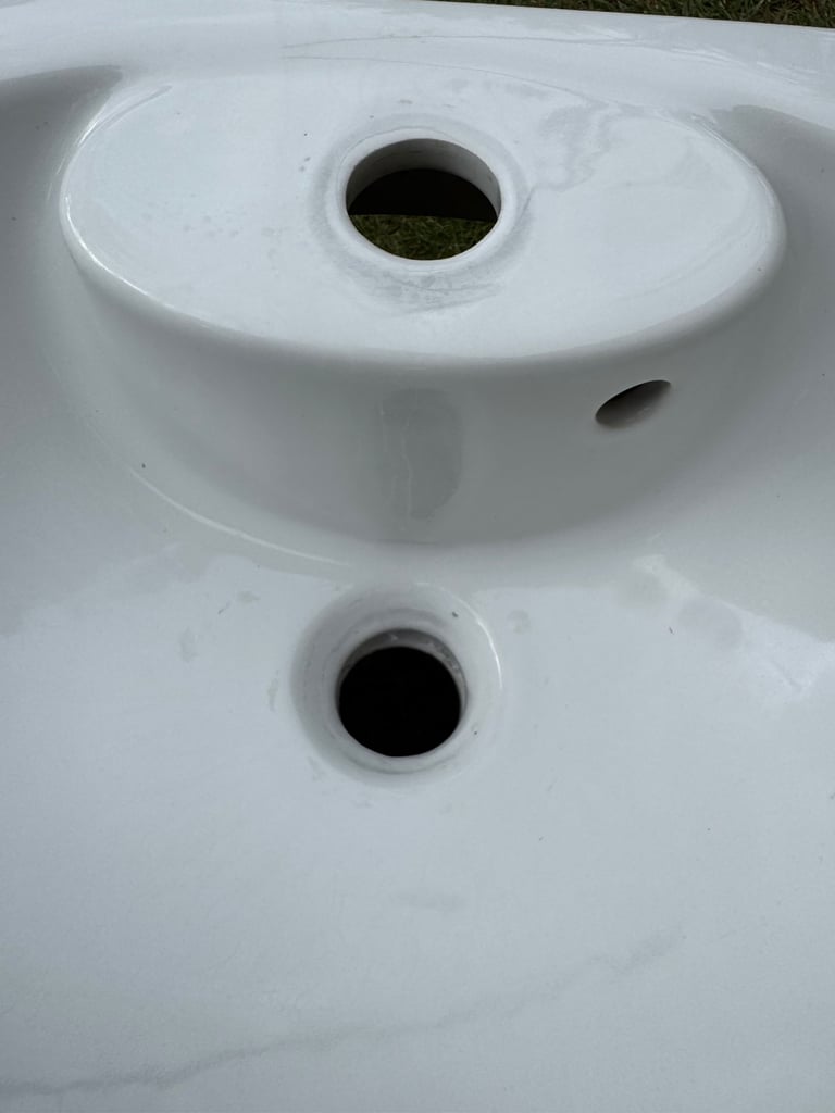 Roca brand white ceramic wall hanging cloakroom sink.  