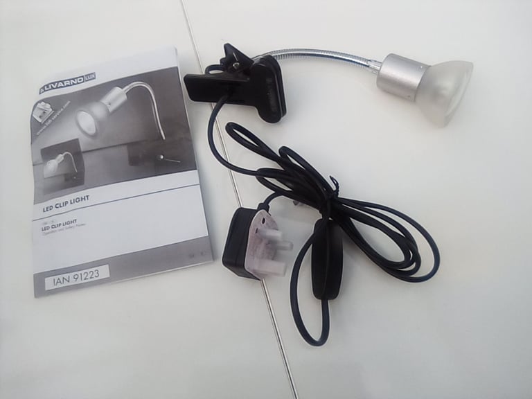 Flexible light, clips onto office desk or work bench.