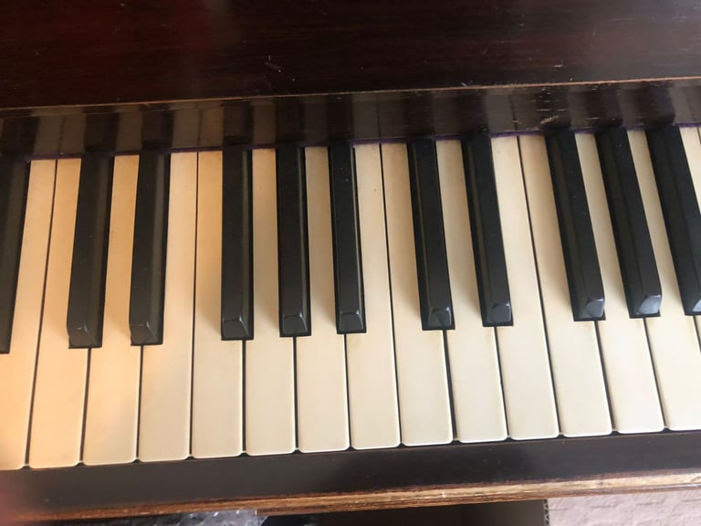 Upright Piano by Stanley Brinsmead London, 7 Octaves, 88 keys, dark wood.  Good condition.
