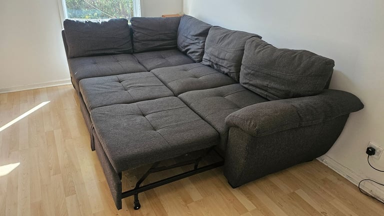 Large corner sofa with storage and pull out bed