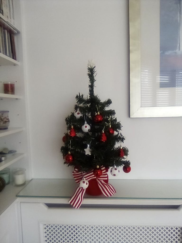 As new small Christmas tree with hanging baubles etc included.