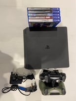 PS4 with 2 controllers & 5 games - hardly used 