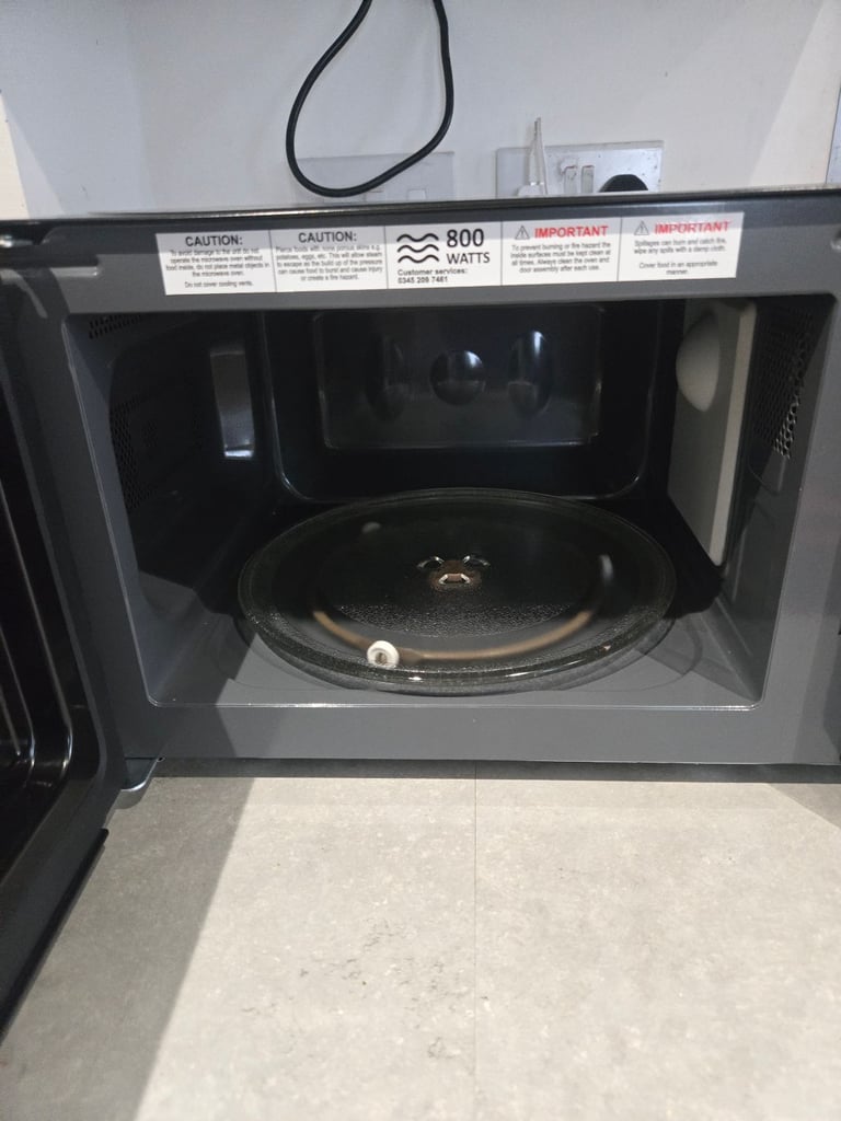 Brand new russell hobbs (rhm2060b) microwave with a small dent on the side (working perfectly)