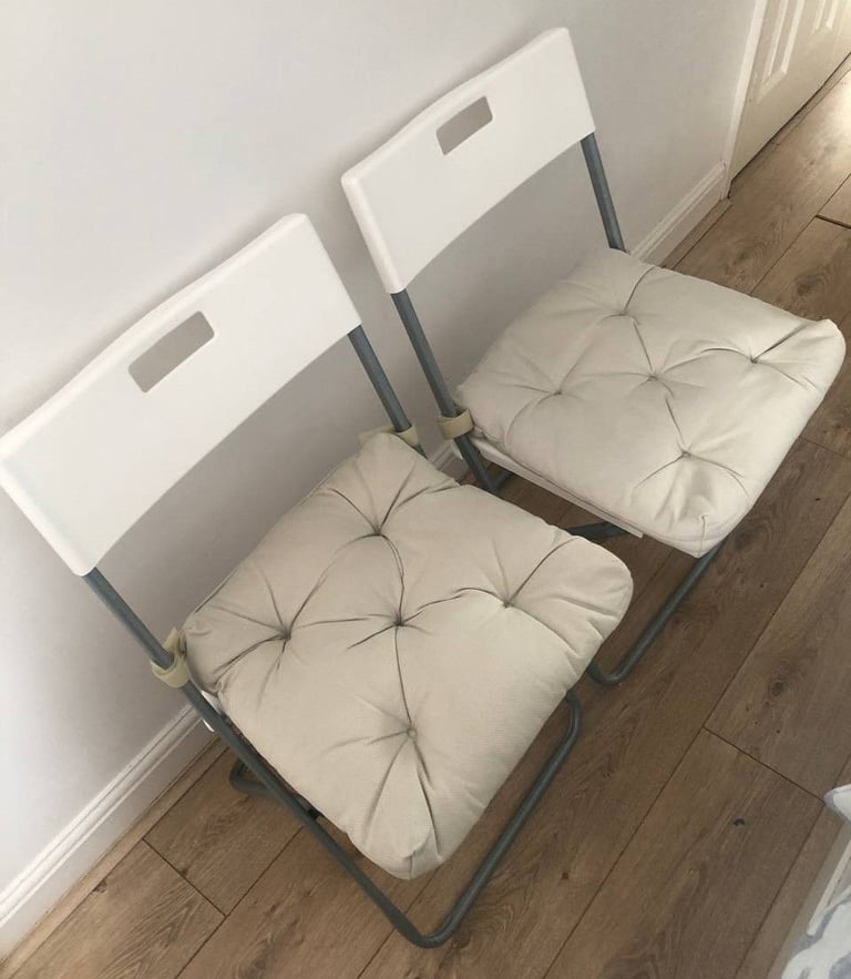 image for 2 Folding white chairs with beige chair cushions