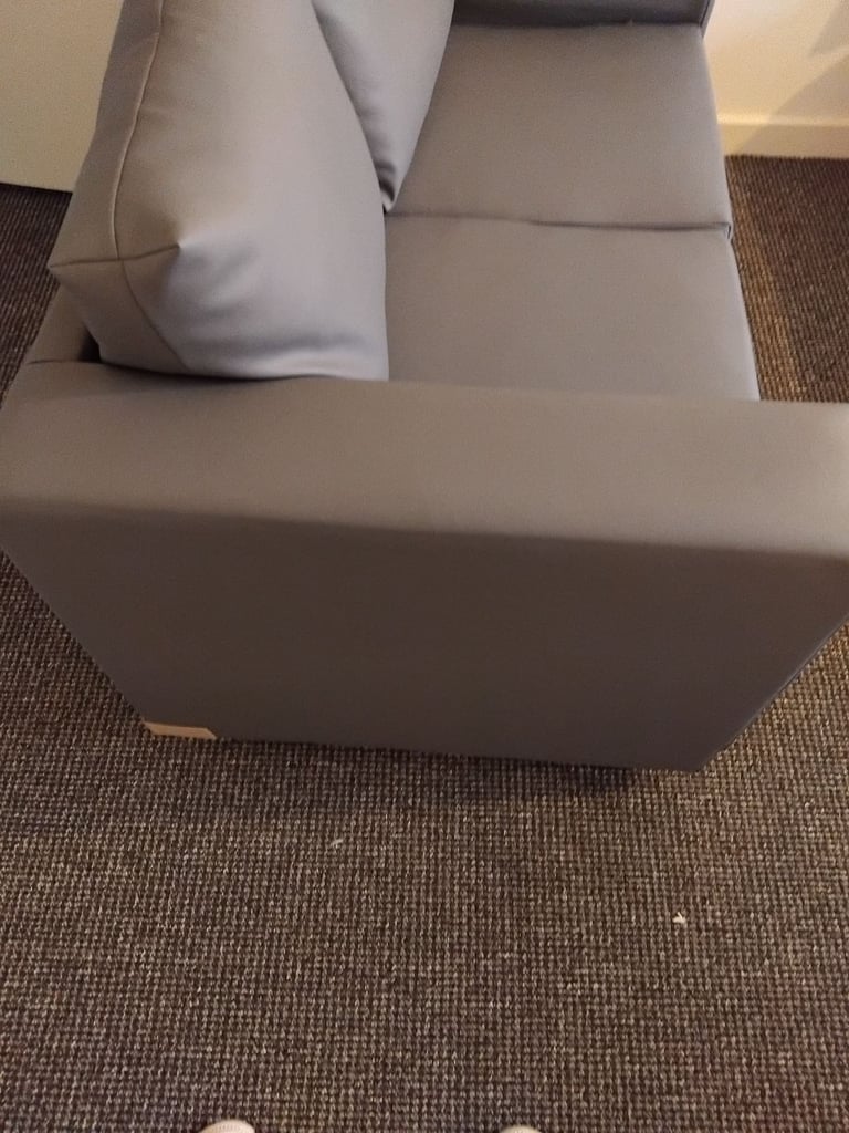 Brand new small 2 seater grey leather couch