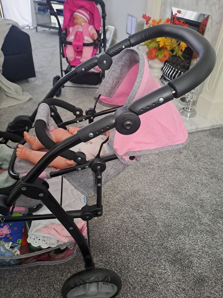 Childrens twin buggies with twin dolls 