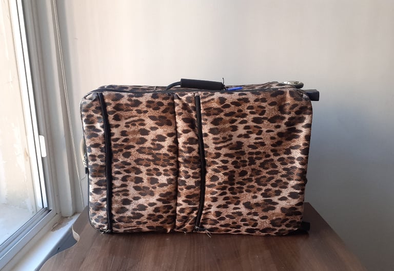Matching pair of wheeled luggage in leopardskin print - stylish & functional