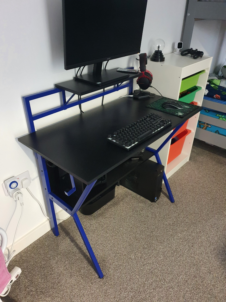 Blue and black gaming desk
