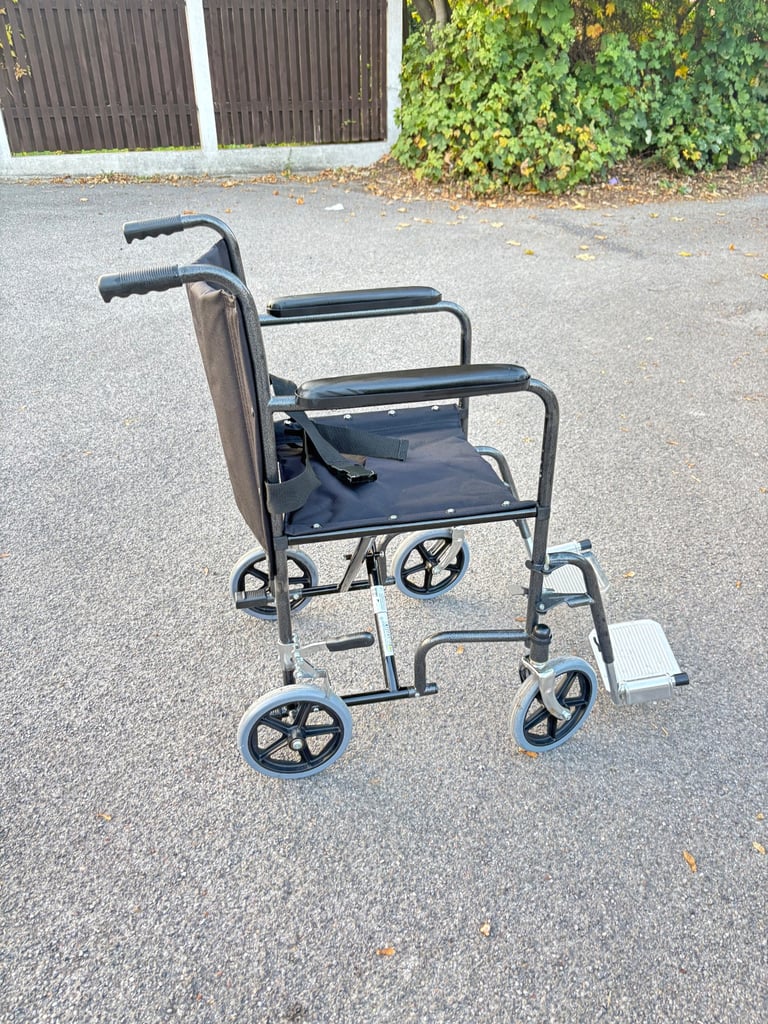 image for Transit wheelchair. Foldable and lightweight with foot rests. Good condition. 