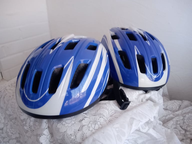 image for 2 adult sized cycling safety helmets