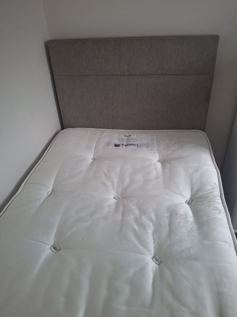 Single bed with mattress and headboard