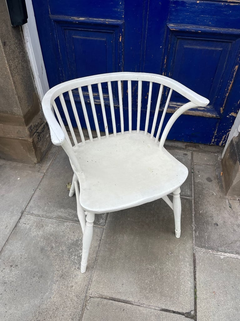 Vintage wooden chair , curved back detail . 